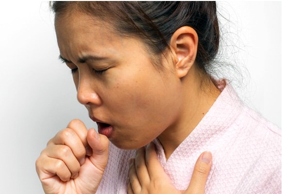 coughing women